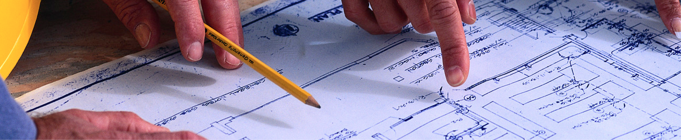 Engineers reviewing layouts