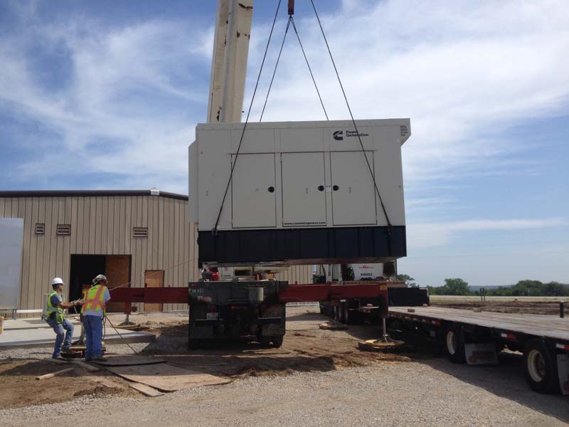 Generator lifted on crane